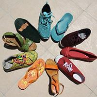 A photo of a collection of colorful shoes arranged in a circle